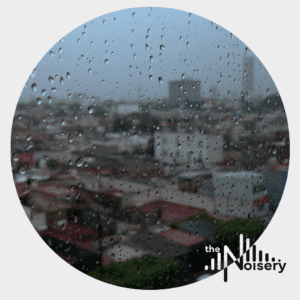 Raindrops blur a cityscape, showcasing the "The Noisery" logo—a rich sound effects library on Sonniss.
