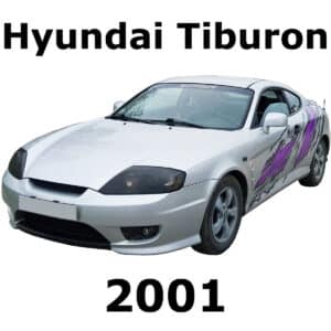 SFX library image: Silver 2001 Hyundai Tiburon with side purple graphics, front-left view. Perfect for detailed automotive sound effects.
