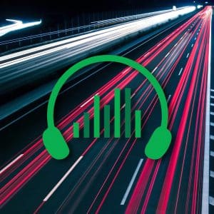 An image of headphones on a highway at night.