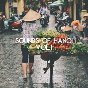A street vendor in Hanoi pushes a bicycle stacked with fresh fruit through a wet, busy street. "SOUNDS OF HANOI VOL.1" appears centered.
