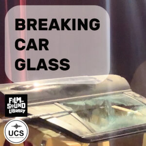 Damaged car roof with shattered glass, set beneath the text “BREAKING CAR GLASS.” Film Sound Library and Universal Category System logos appear in the corner.
