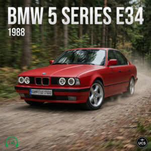 Red 1988 BMW 5 Series E34 executive car driving along a dirt forest road.