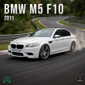 White BMW M5 F10 2011 sports saloon drifts around a racetrack bend.