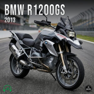2013 BMW R1200GS silver and black dual sport motorcycle parked on a racetrack.