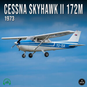 Cessna Skyhawk II 172M 1973 small blue and white propeller plane in flight against a clear blue sky.