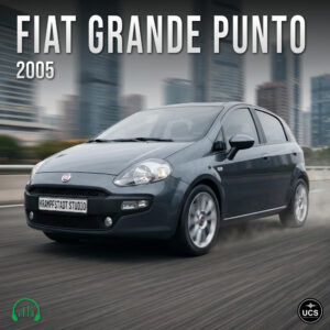 A grey 2005 Fiat Grande Punto supermini hatchback drives fast on a blurred city dual carriageway.