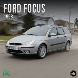 Silver 1998 Ford Focus compact car driving on a suburban road.