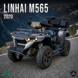 Linhai M565 2020 ATV with a storage box parked on a mountain asphalt road.