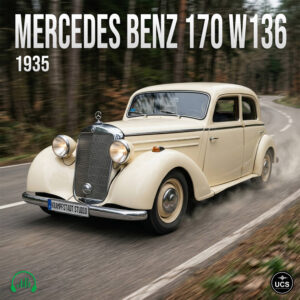 Cream-colored 1935 Mercedes Benz 170 W136 executive car drives along a winding forest road.