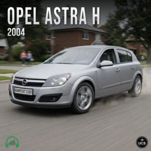 Silver Opel Astra H 2004 compact hatchback car driving on a suburban road.