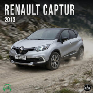 Silver 2013 Renault Captur subcompact crossover SUV drives fast on a dirt track with dust rising behind tyres.