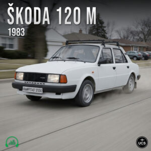 White Škoda 120 M 1983 compact saloon with a roof rack drives along a suburban street.